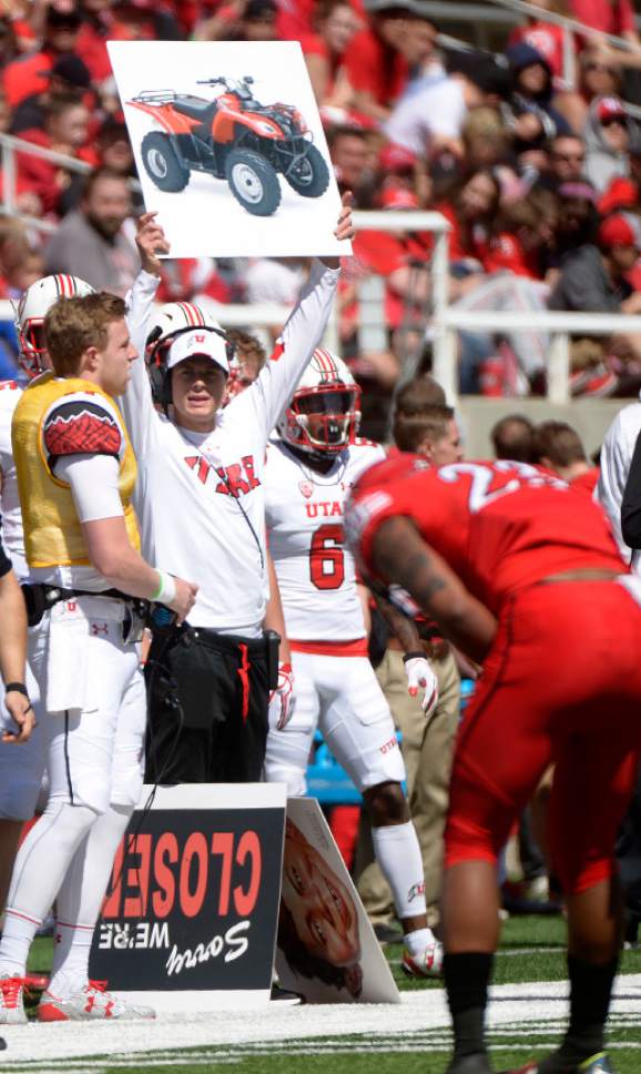 Leah Hogsten  |  The Salt Lake Tribune 
A variety of interesting and unusual placards reveal new plays. The University of Utah Utes were back in action  during the 16th-annual Red-White football game on Saturday, April 15, 2017 at  Rice-Eccles Stadium.