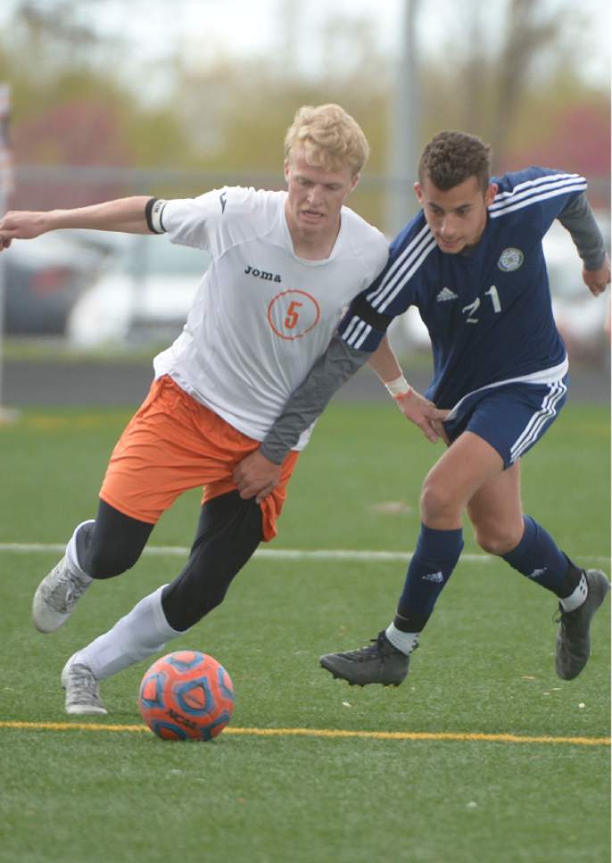 Leah Hogsten  |  The Salt Lake Tribune 
Murray's Tanner Erekson battles Skyline"s Arno Coppa. Murray High School boys' soccer team defeated Skyline High School 3-2 in double overtime during their game at Murray, Friday, April 14, 2017
