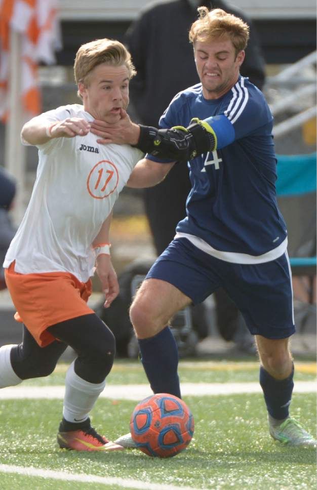 Leah Hogsten  |  The Salt Lake Tribune 
Murray's Beamer Wilcken and Skyline's Alex Jackson battle for possession. Murray High School boys' soccer team defeated Skyline High School 3-2 in double overtime during their game at Murray, Friday, April 14, 2017