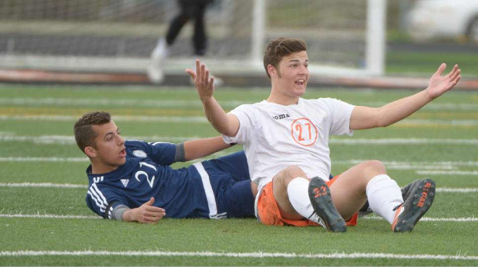 Leah Hogsten  |  The Salt Lake Tribune 
Murray's Ryan O'Neill cries foul on Skyline's Arno Coppa. Murray High School boys' soccer team defeated Skyline High School 3-2 in double overtime during their game at Murray, Friday, April 14, 2017