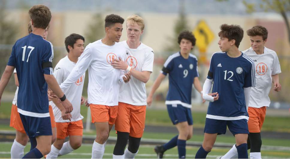 Leah Hogsten  |  The Salt Lake Tribune 
The team celebrates Murray's Drayden Ricks' first half goal. Murray High School boys' soccer team defeated Skyline High School 3-2 in double overtime during their game at Murray, Friday, April 14, 2017