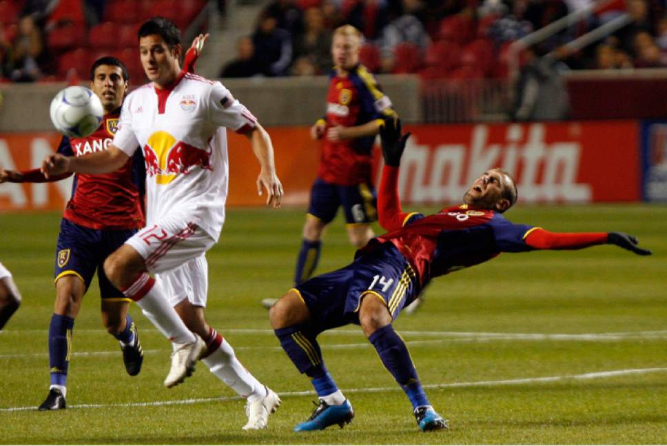 Steve Grifffin  |  The Salt Lake Tribune


Real Salt Lake's Yura Movsisyan , right, falls backwards after being pushed by Mike Petke of the Red Bulls during RSL's 2-0 win at Rio Tinto Stadium.