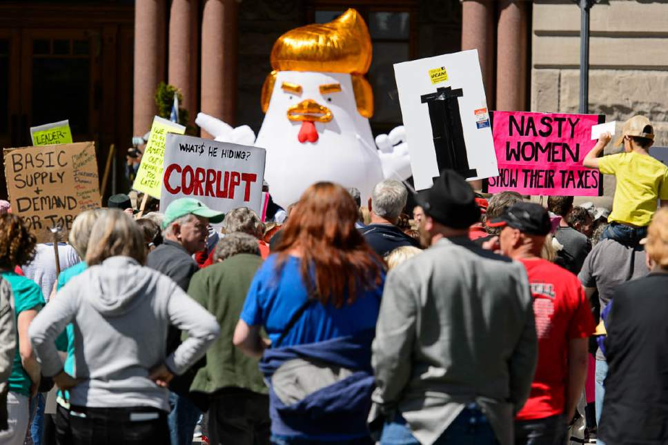 Trent Nelson  |  The Salt Lake Tribune
"Chicken Don" looms over a rally calling for President Trump to release his tax returns, which took place at the Salt Lake City and County Building, Saturday April 15, 2017.