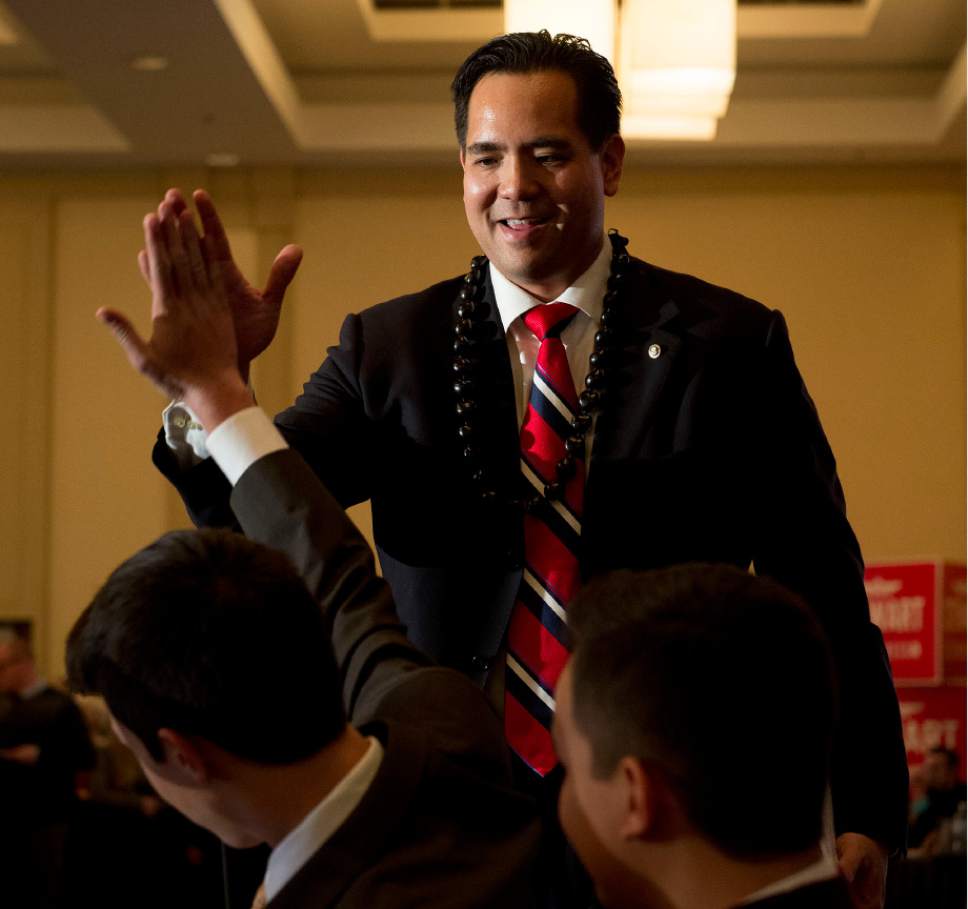 Steve Griffin  |   Tribune file photo

Attorney General Sean Reyes high fives his son Kai after delivering his victory speech during the GOP election night party at the Hilton in downtown Salt Lake City, Tuesday November 4, 2014.