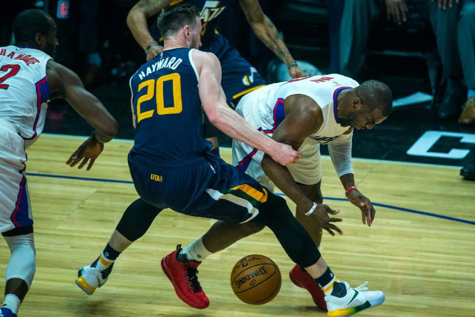 Chris Detrick  |  The Salt Lake Tribune
Utah Jazz forward Gordon Hayward (20) and LA Clippers center DeAndre Jordan (6) go for the ball during Game 1 of the Western Conference at the Staples Center Saturday, April 15, 2017.