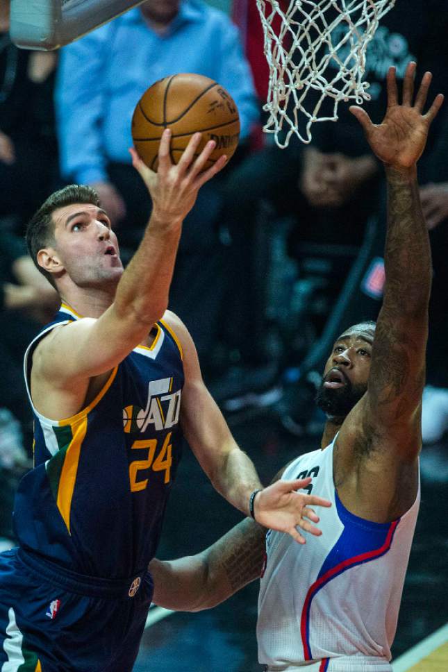 Chris Detrick  |  The Salt Lake Tribune
Utah Jazz center Jeff Withey (24) shoots past LA Clippers center DeAndre Jordan (6) during Game 1 of the Western Conference at the Staples Center Saturday, April 15, 2017.