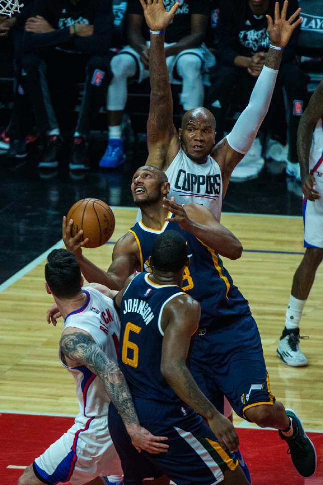 Chris Detrick  |  The Salt Lake Tribune
Utah Jazz center Boris Diaw (33) shoots past LA Clippers center Marreese Speights (5) and LA Clippers guard JJ Redick (4) during Game 1 of the Western Conference at the Staples Center Saturday, April 15, 2017.