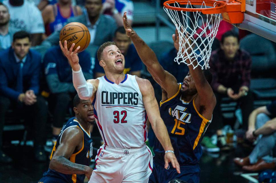 Chris Detrick  |  The Salt Lake Tribune
LA Clippers forward Blake Griffin (32) shoots past Utah Jazz forward Derrick Favors (15) and Utah Jazz forward Joe Johnson (6) during Game 1 of the Western Conference at the Staples Center Saturday, April 15, 2017.