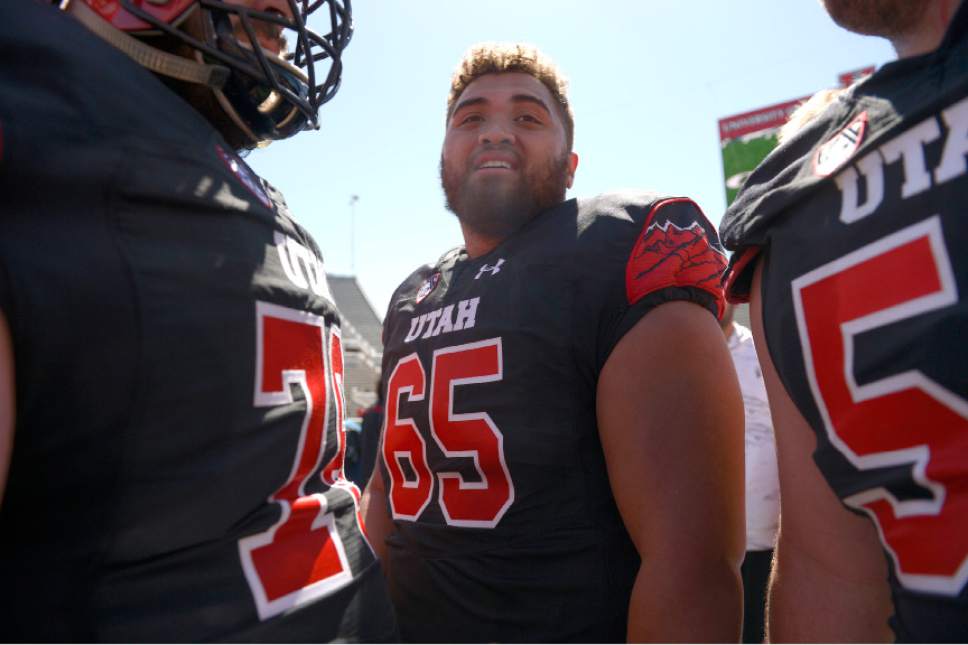 Leah Hogsten  |  The Salt Lake Tribune 
Offensive lineman Paul Toala talks with teammates after the game. The University of Utah Utes were back in action  during the 16th-annual Red-White football game on Saturday, April 15, 2017 at  Rice-Eccles Stadium.