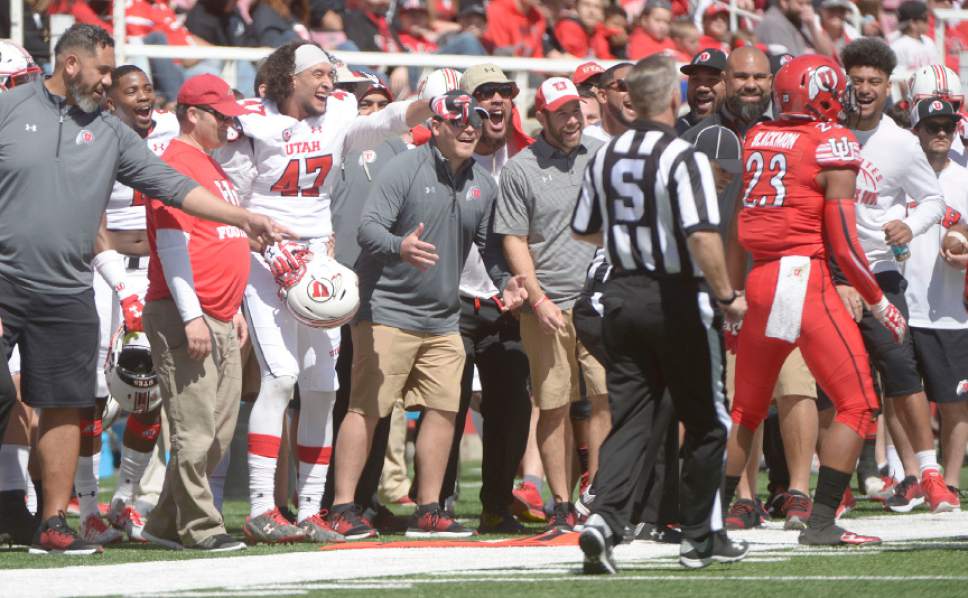 Leah Hogsten  |  The Salt Lake Tribune 
The sideline reacts to a hit by Julian Blackmon. The University of Utah Utes were back in action  during the 16th-annual Red-White football game on Saturday, April 15, 2017 at  Rice-Eccles Stadium.