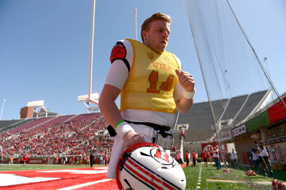 Leah Hogsten  |  The Salt Lake Tribune 
Quarterback Drew Lisk leaves the field at halftime. The University of Utah Utes were back in action  during the 16th-annual Red-White football game on Saturday, April 15, 2017 at  Rice-Eccles Stadium.