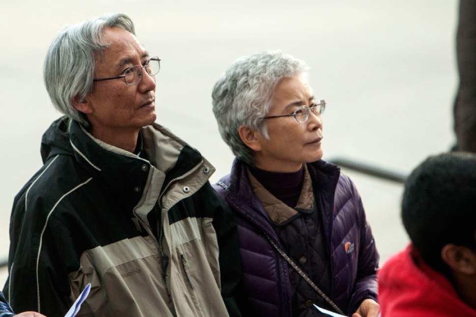 Chris Detrick  |  The Salt Lake Tribune
First United Methodist Church Pastor Eun-sang Lee and his wife Yvonne Lee, Pastor at Centenary United Methodist Church, participate in the Good Friday Procession of the Cross Friday April 6, 2012.