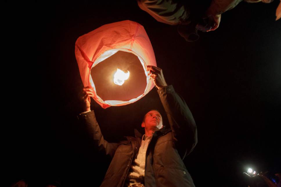 Trent Nelson  |  The Salt Lake Tribune
Robbie Parker releases a lantern in memory of his daughter, Emilie Parker, following a public memorial for Emilie Parker at Ben Lomond High School in Ogden, Thursday December 20, 2012. Lanterns were lit and released for each victim killed in the Sandy Hook Elementary School shooting