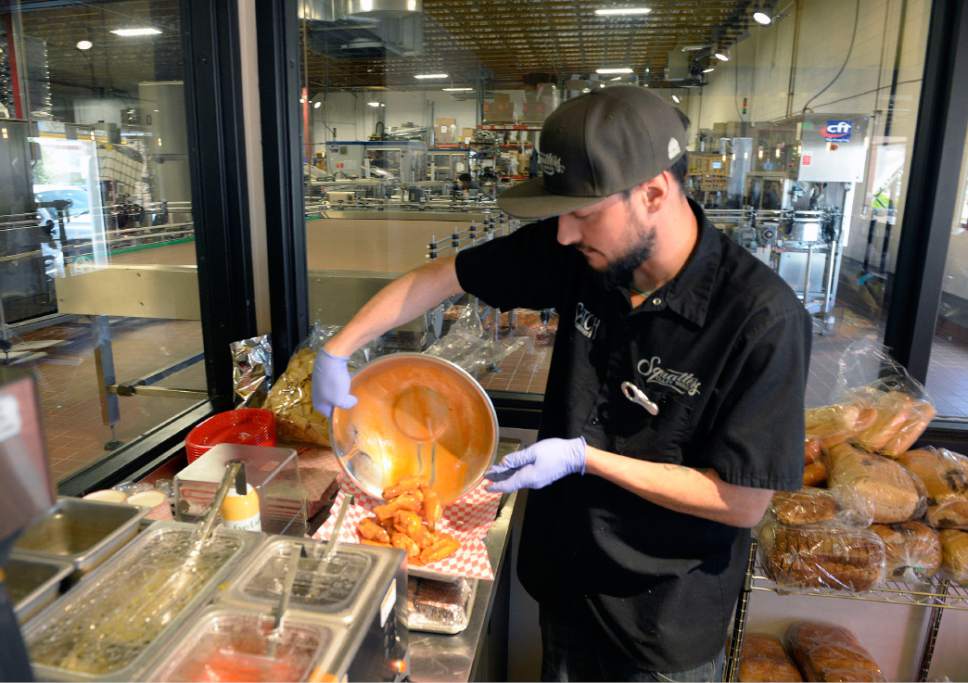 Al Hartmann  |  The Salt Lake Tribune
Bartender Matt Green whips up an order of Squatters Legendary Buffalo Wings at West Side Tavern, a new bar that has opened as part of the Wasatch/Squatters Beer Store at 1763 W. 300 South in Salt Lake City.