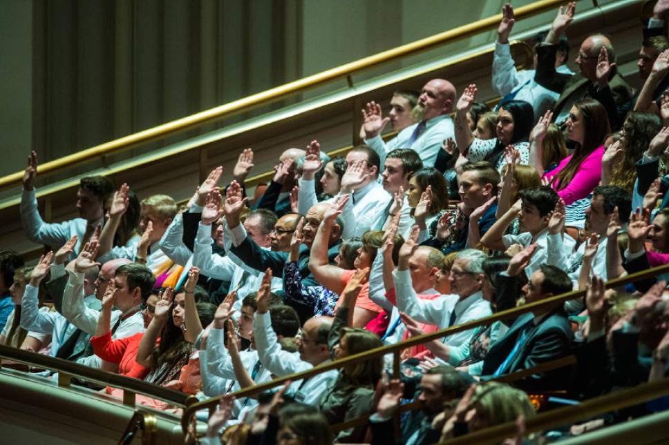 Chris Detrick  |  The Salt Lake Tribune
Members affirm a vote during the afternoon session of the 187th Annual General Conference at the Conference Center in Salt Lake City Saturday, April 1, 2017.