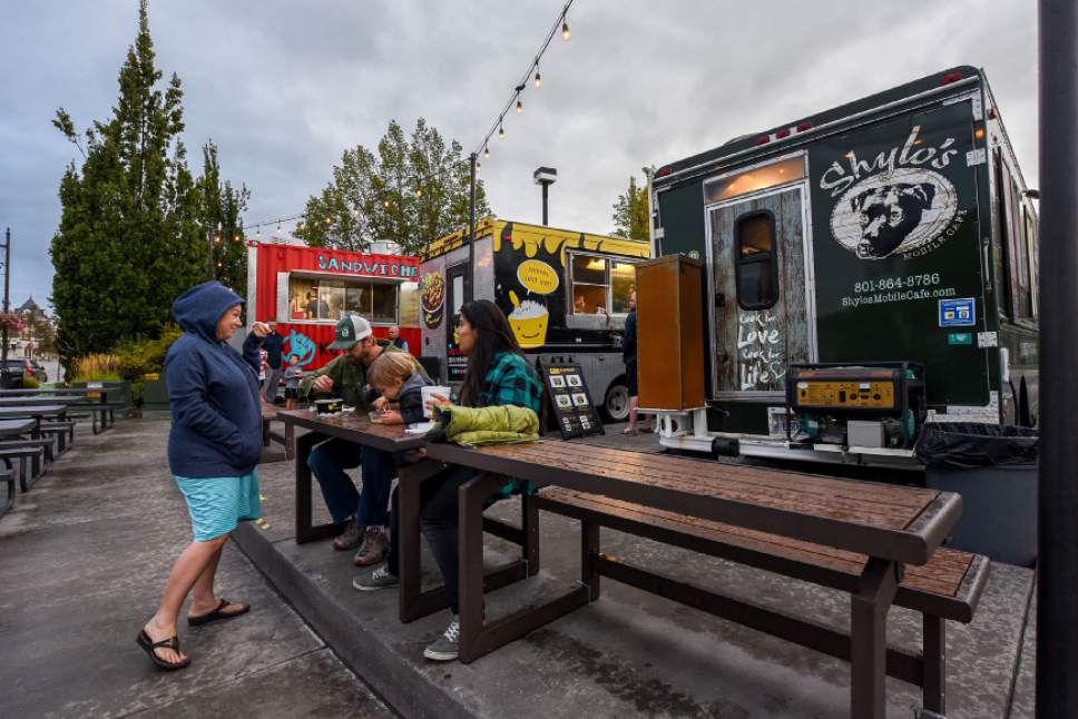 Francisco Kjolseth | The Salt Lake Tribune
The new Food Truck League Finder app helps customers, like these gathered at the Soho Food Park in Holladay,  find the nearest mobile food vendor.