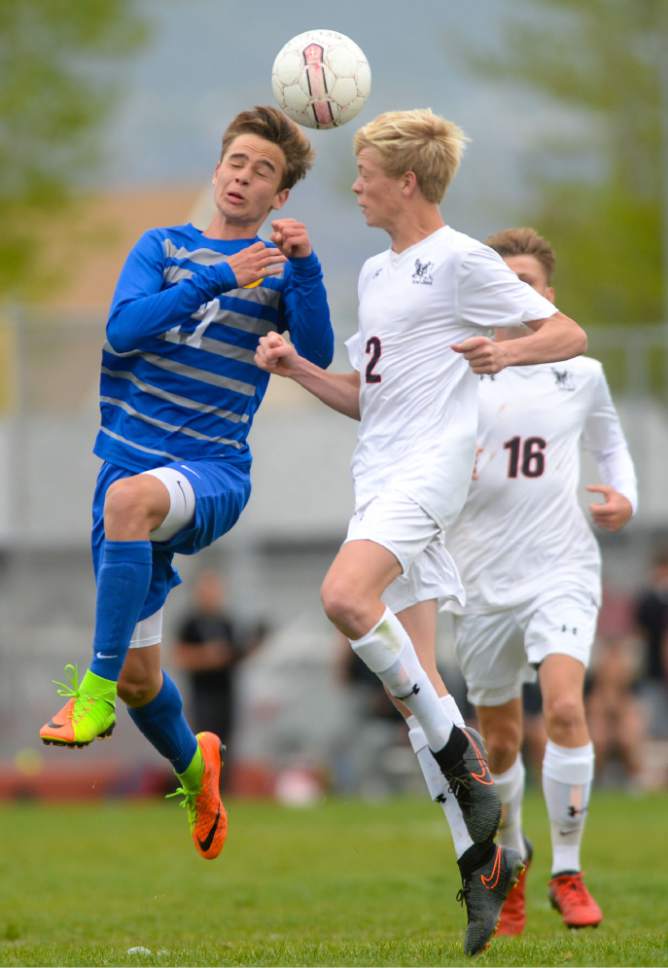 Steve Griffin  |  The Salt Lake Tribune


Orem's Kadon Black, left, heads the ball past Alta's Colby Young during soccer match at Alta High School in Sandy Tuesday April 18, 2017.