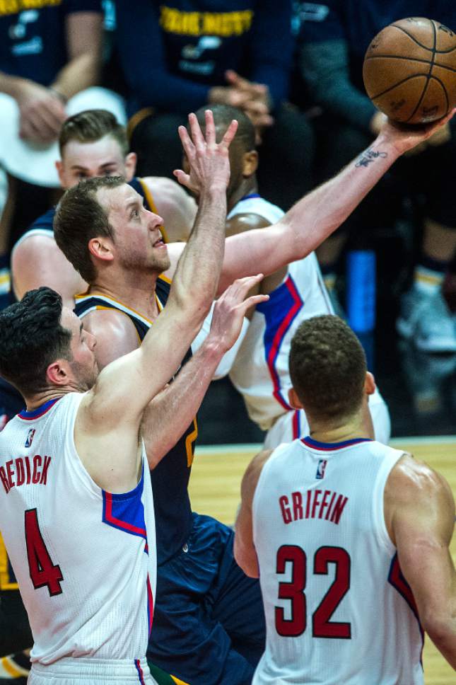 Chris Detrick  |  The Salt Lake Tribune
Utah Jazz forward Joe Ingles (2) shoots past LA Clippers guard JJ Redick (4) and LA Clippers forward Blake Griffin (32) during Game 2 of the Western Conference at the Staples Center Tuesday, April 18, 2017.  LA Clippers defeated Utah Jazz 99-91.