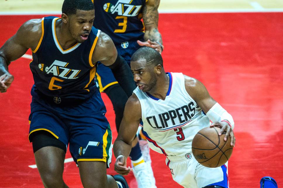 Chris Detrick  |  The Salt Lake Tribune
LA Clippers guard Chris Paul (3) runs past Utah Jazz forward Joe Johnson (6) and Utah Jazz guard George Hill (3) during Game 2 of the Western Conference at the Staples Center Tuesday, April 18, 2017.  LA Clippers defeated Utah Jazz 99-91.