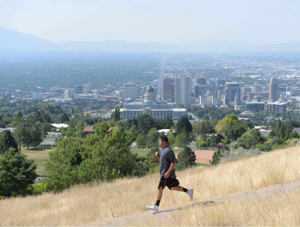 Al Hartmann | Tribune file photo
The Salt Lake Valley during a 2016 day when levels of health-threatening ozone levels were high. Lawyers for the U.S. Environmental Protection Agency signaled Tuesday the agency is reconsider a 2015 rule that reduced allowable ozone levels.