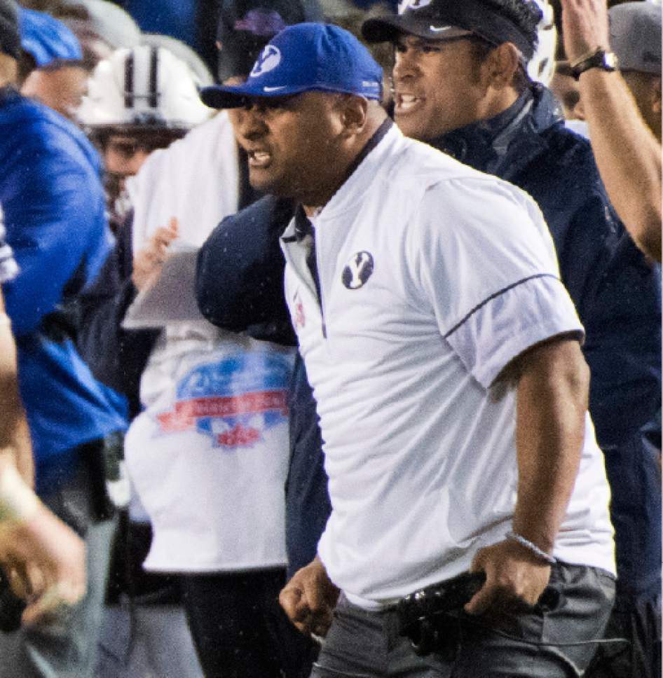 Rick Egan  |  The Salt Lake Tribune

Brigham Young head coach Kalani Sitake reacts after a big play for the Cougars, in the Poinsettia Bowl, at Qualcomm Stadium in San Diego, December 21, 2016.
