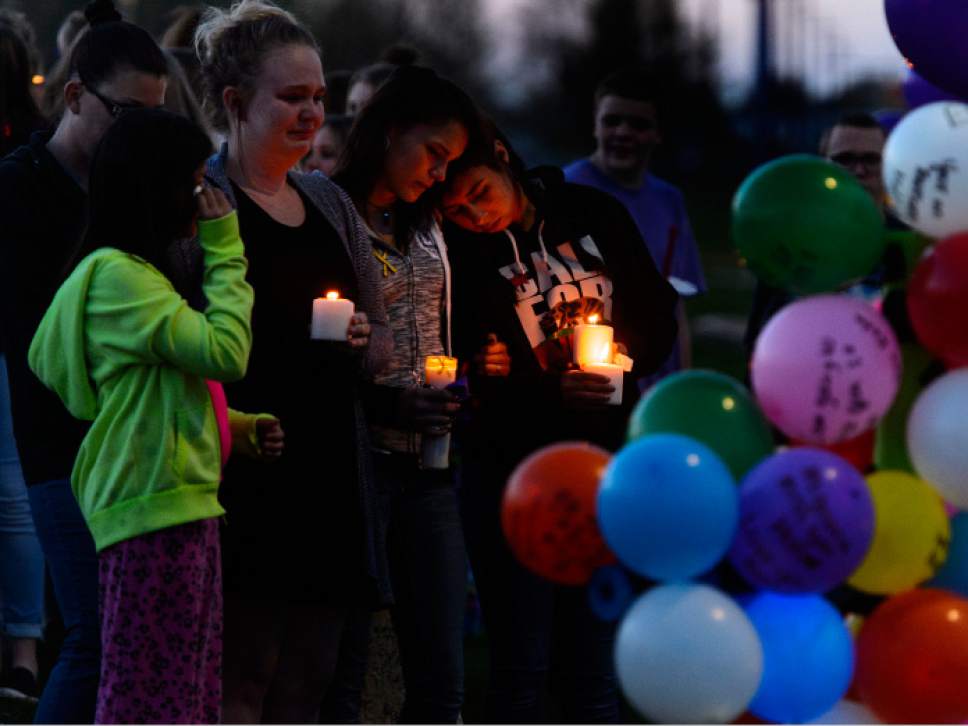 Steve Griffin  |  The Salt Lake Tribune


Classmates of Dakota Kilburn attend a candlelight vigil for their friend who died from injuries he suffered after being hit by a car then pinned under another car in front of Syracuse Junior High School in Syracuse Wednesday April 19, 2017. Hundreds of people attend the vigil at the Syracuse junior high school.
