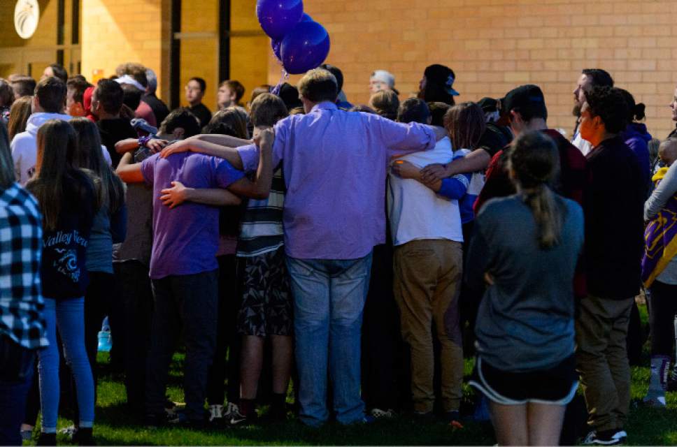 Steve Griffin  |  The Salt Lake Tribune


Classmates of Dakota Kilburn attend a candlelight vigil for their friend who died from injuries he suffered after being hit by a car then pinned under another car in front of Syracuse Junior High School in Syracuse Wednesday April 19, 2017. Hundreds of people attend the vigil at the Syracuse junior high school.