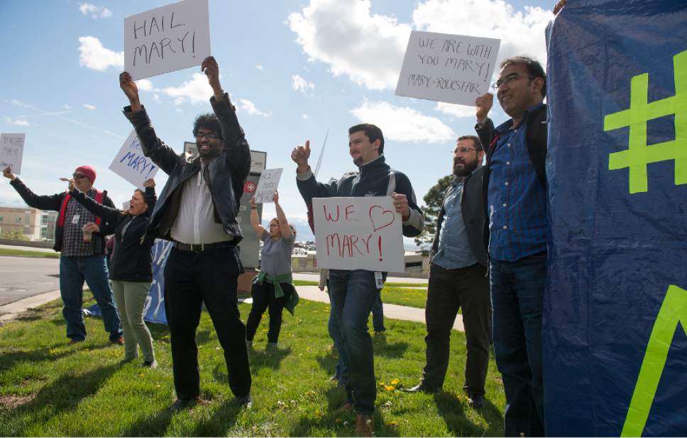 Leah Hogsten  |  The Salt Lake Tribune 
l-r Sasi Arunachalam, Atakan Ekiz, Ismail Can, and Jeetendra Kumar join fellow Huntsman Cancer Institute employees and University of Utah faculty members staged a sign-waving, honk-and-wave across the street from the University of Utah Hospital during the third day of protests over the firing of Huntsman Cancer Institute director and CEO Mary Beckerle.