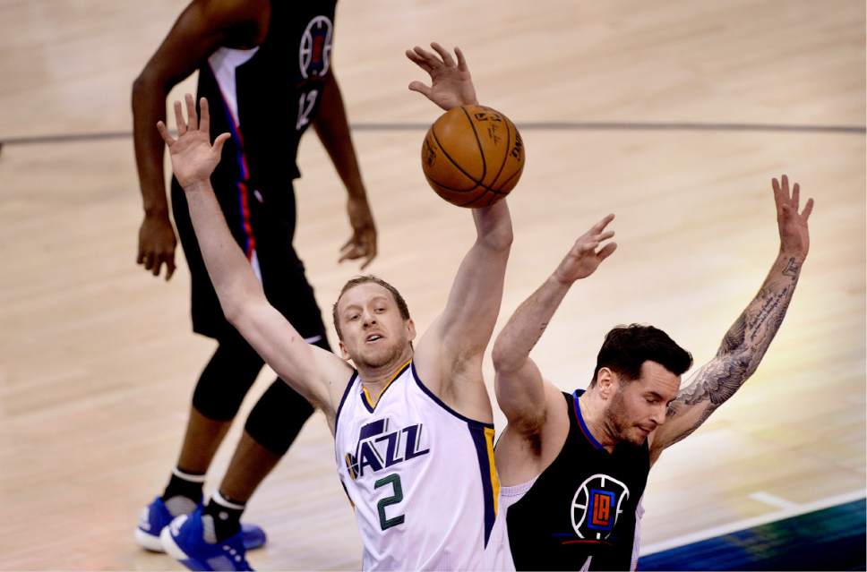 Scott Sommerdorf | The Salt Lake Tribune
Utah Jazz forward Joe Ingles (2) and LA Clippers guard JJ Redick (4) get tangled up fighting fvor a loose rebound during first half play. Utah took a 58-49 lead at the half of Game 3 of the Western Conference playoff series, Friday, April 21, 2017.