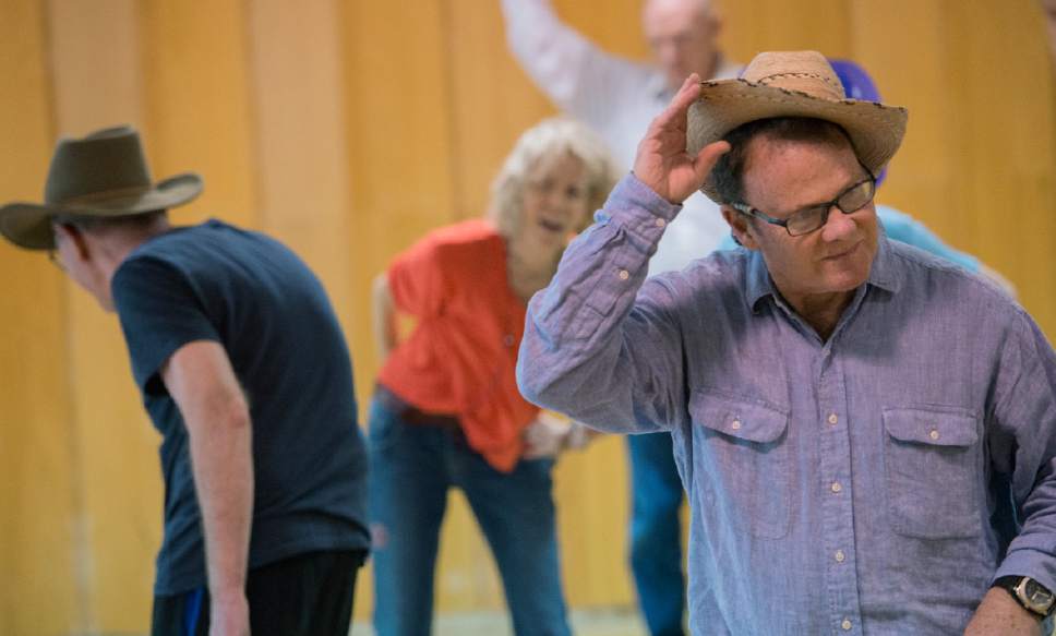 Leah Hogsten  |  The Salt Lake Tribune 
Eric Hanson, right, performs during a dress rehearsal Thursday, April 20, 2017, at the 10th East Senior Center for a Saturday, April 22 dance performance, "That 70's Show" by Grey Matters Dance for Parkinson's - Utah. The Grey Matters program is a way for participants to use dance and creativity to alleviate the physical, social, emotional and cognitive symptoms of the disease.