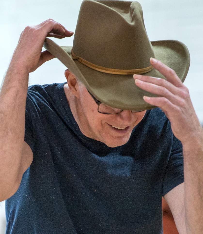 Leah Hogsten  |  The Salt Lake Tribune 
Wes Starkenburg adjusts his cowboy hat before a dance during a dress rehearsal Thursday, April 20, 2017, at the 10th East Senior Center for a Saturday, April 22 dance performance, "That 70's Show" by Grey Matters Dance for Parkinson's - Utah. The Grey Matters program is a way for participants to use dance and creativity to alleviate the physical, social, emotional and cognitive symptoms of the disease.