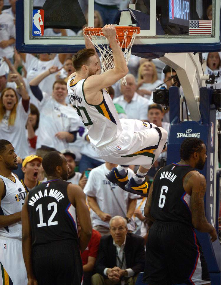 Leah Hogsten  |  The Salt Lake Tribune 
Utah Jazz forward Gordon Hayward (20) stuffs the net over LA Clippers forward Luc Mbah a Moute (12) and LA Clippers center DeAndre Jordan (6). The Utah Jazz lead the Los Angeles Clippers after the third quarter during Game 3 of their first-round Western Conference playoff series at Vivint Smart Home Arena, Friday, April 21, 2017.
