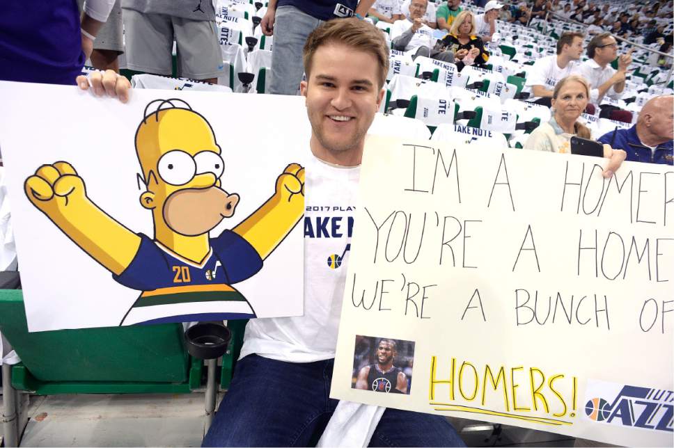 Scott Sommerdorf | The Salt Lake Tribune
Jazz fan Spencer Richards riffs off the "Homer" name-calling with his signs prior to Game 3 of the Western Conference playoff series, Friday, April 21, 2017.