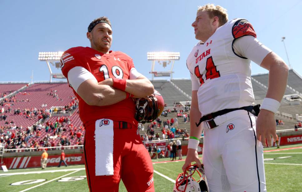 Leah Hogsten  |  The Salt Lake Tribune 
l-r Quarterbacks Cooper Bateman and Drew Lisk discuss the game. The University of Utah Utes were back in action during the 16th-annual Red-White football game on Saturday, April 15, 2017 at  Rice-Eccles Stadium.