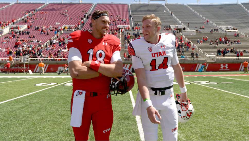 Leah Hogsten  |  The Salt Lake Tribune 
Quarterbacks Cooper Bateman and Drew Lisk share a laugh while leaving the field after the game. The University of Utah Utes were back in action during the 16th-annual Red-White football game on Saturday, April 15, 2017 at  Rice-Eccles Stadium.