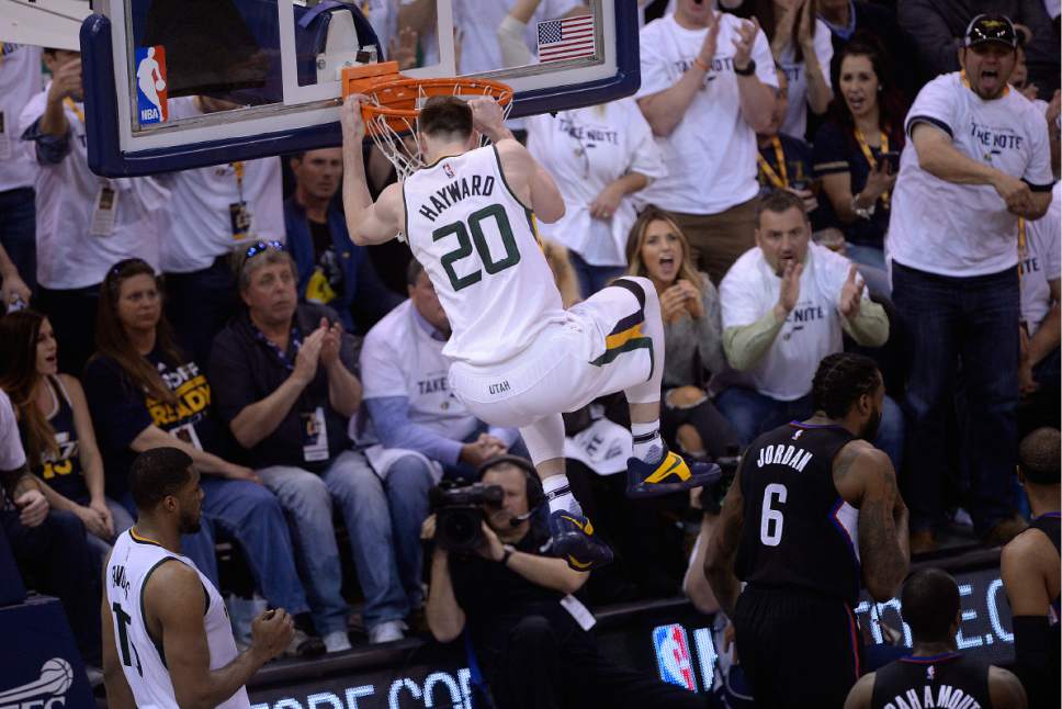 Scott Sommerdorf | The Salt Lake Tribune
Utah Jazz forward Gordon Hayward (20) hangs on the rim after a huge dunk during second half play. The LA Clippers won Game 3 of the Western Conference playoff series 111-106, Friday, April 21, 2017.