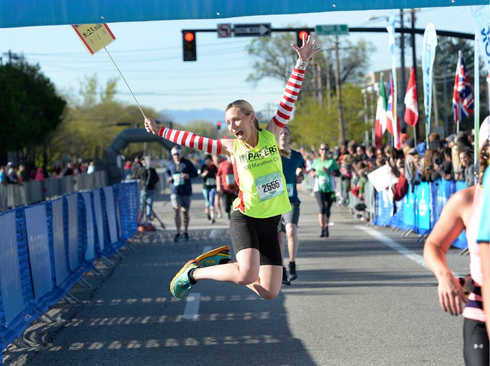 Scott Sommerdorf | The Salt Lake Tribune
Keisha Baldwin celebrates as she crosses the finish line in the half-marathon part of the 2017 Salt Lake Marathon, Saturday, April 22, 2017.