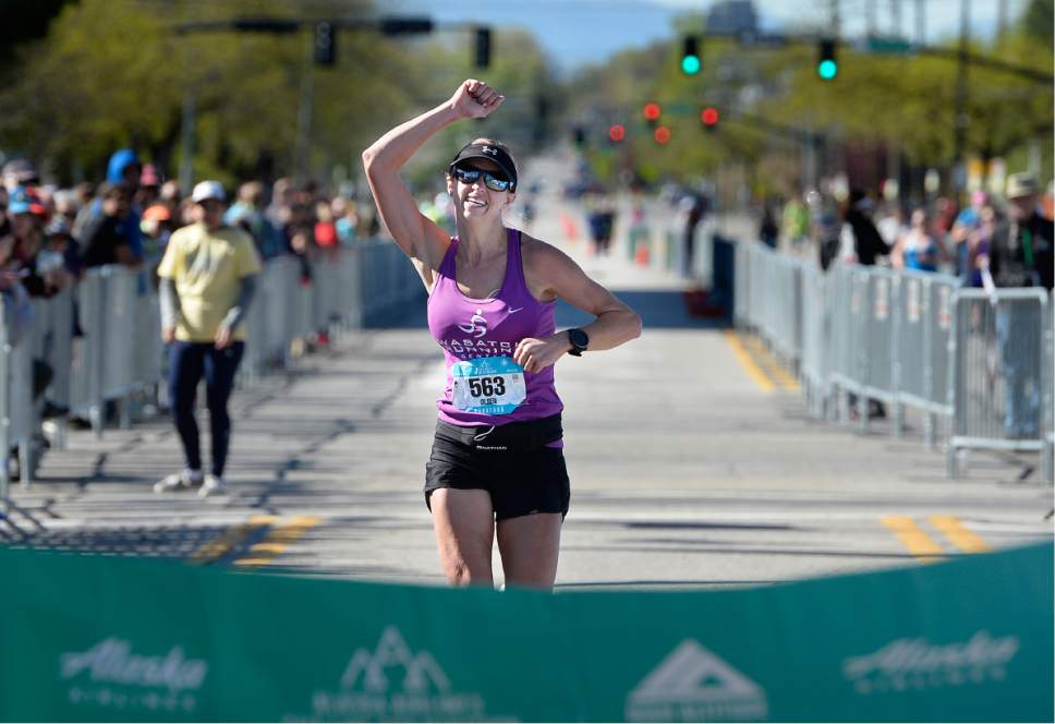 Scott Sommerdorf | The Salt Lake Tribune
Kristen Olsen reacts as she is about to cross the finish line as the female winner of the 2017 Salt Lake Marathon, Saturday, April 22, 2017.