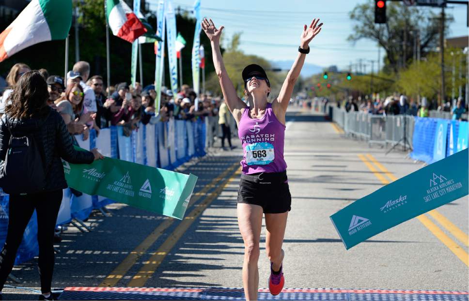 Scott Sommerdorf | The Salt Lake Tribune
Kristen Olsen reacts as she crosses the finish line as the female winner of the 2017 Salt Lake Marathon, Saturday, April 22, 2017.