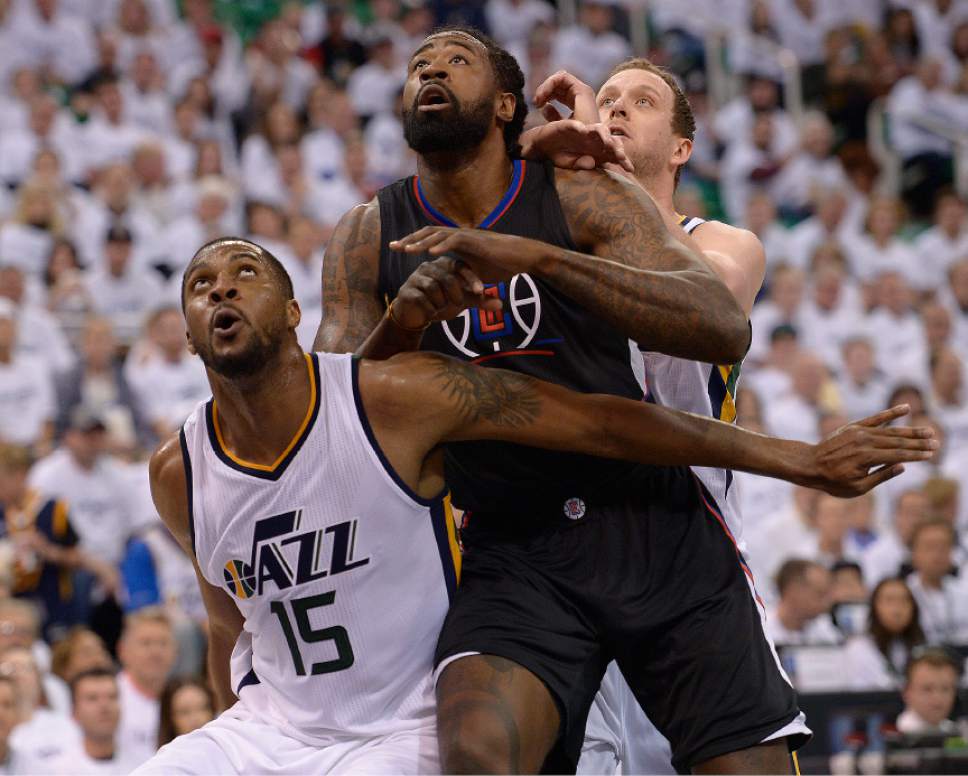 Leah Hogsten  |  The Salt Lake Tribune 
Utah Jazz forward Derrick Favors (15) battles LA Clippers center DeAndre Jordan (6) for the rebound. The Utah Jazz lead the Los Angeles Clippers after the third quarter during Game 3 of their first-round Western Conference playoff series at Vivint Smart Home Arena, Friday, April 21, 2017.
