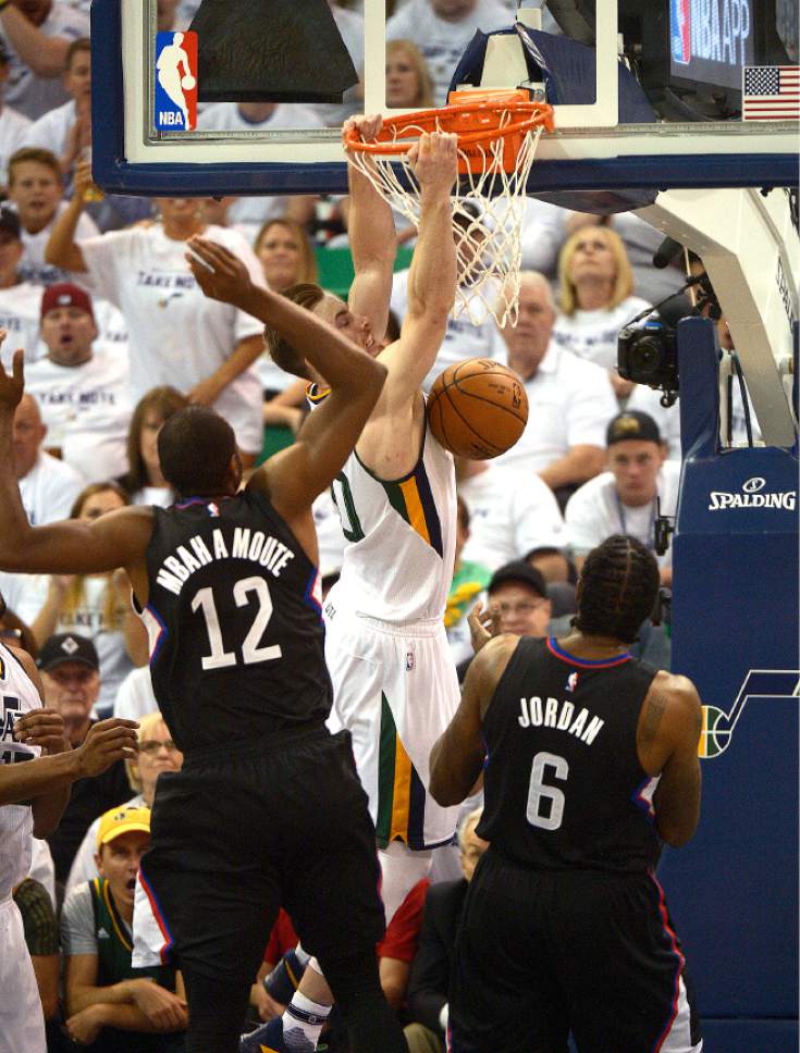 Leah Hogsten  |  The Salt Lake Tribune 
Utah Jazz forward Gordon Hayward (20) stuffs the net over LA Clippers forward Luc Mbah a Moute (12) and LA Clippers center DeAndre Jordan (6). The Utah Jazz lead the Los Angeles Clippers after the third quarter during Game 3 of their first-round Western Conference playoff series at Vivint Smart Home Arena, Friday, April 21, 2017.
