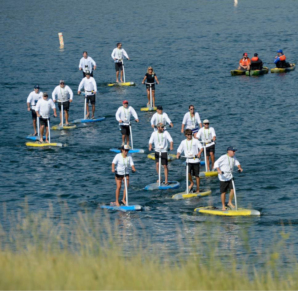 Al Hartmann  |  The Salt Lake Tribune 
Folks try out pedal-powered stand up paddle boards at the the annual Outdoor Retailer Summer trade show at Pineview Reservoir Tues. Aug. 2.
