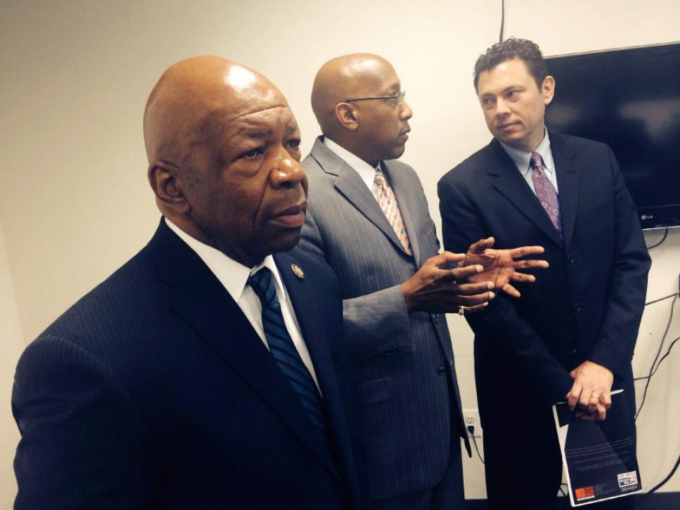 Thomas Burr  |  Tribune file photo
Rep. Elijiah Cummings, D-Md., (left) hosted Rep. Jason Chaffetz, R-Utah, (right) in a tour of the Democrat's district, including this visit to the Center for Urban Families. The center director, Joseph Jones, (center) explains the organization.