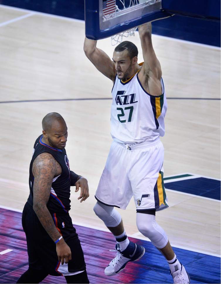 Scott Sommerdorf | The Salt Lake Tribune
Utah Jazz center Rudy Gobert (27) gives LA Clippers center Marreese Speights (5) a fearsome look while following through an an early dunk during first quarter play. The Utah Jazz trailed the LA Clipper 26-24 at the end of the first period of Game 4 of the Western Conference playoffs, Sunday, April 23, 2017.