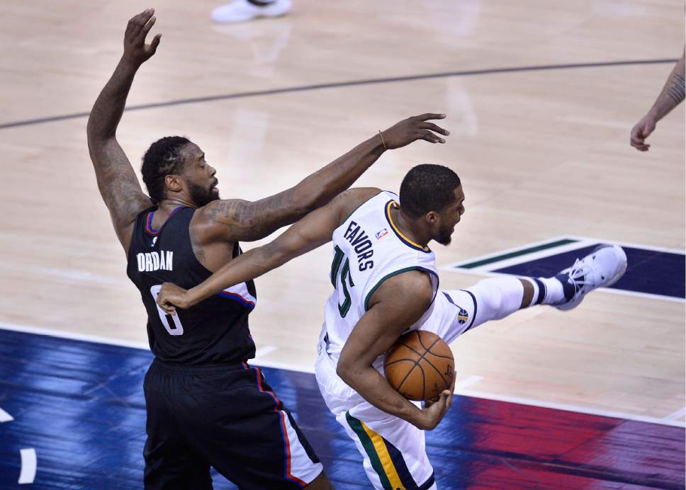 Scott Sommerdorf | The Salt Lake Tribune
Utah Jazz forward Derrick Favors (15) gets tangled up with LA Clippers center DeAndre Jordan (6) during this first quarter rebound. The Utah Jazz trailed the LA Clipper 26-24 at the end of the first period of Game 4 of the Western Conference playoffs, Sunday, April 23, 2017.