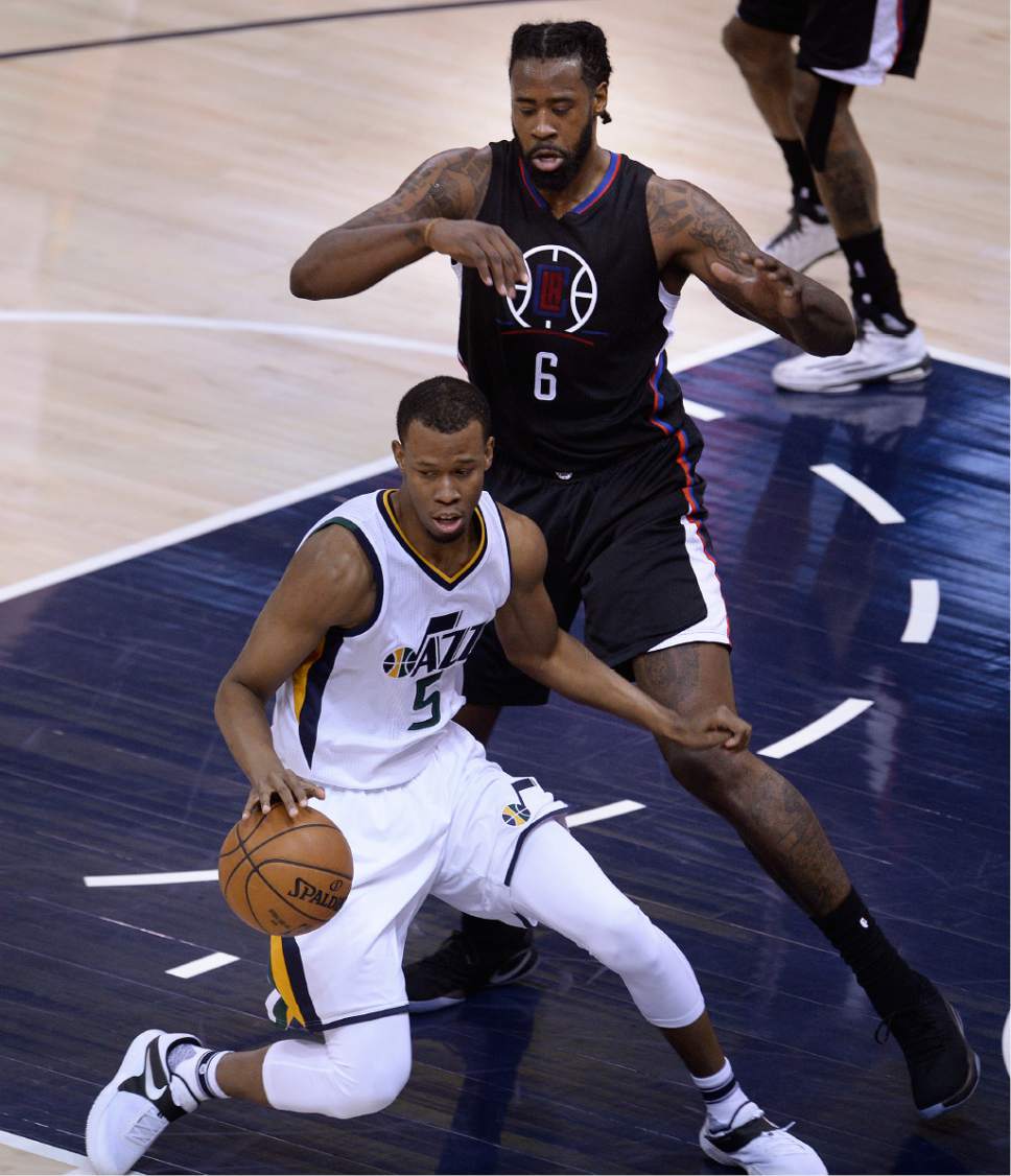 Scott Sommerdorf | The Salt Lake Tribune
Utah Jazz guard Rodney Hood (5) is stopped in the paint by LA Clippers center DeAndre Jordan (6) during first quarter play. The Utah Jazz trailed the LA Clipper 26-24 at the end of the first period of Game 4 of the Western Conference playoffs, Sunday, April 23, 2017.