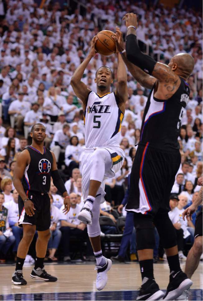 Steve Griffin  |  The Salt Lake Tribune


Utah Jazz guard Rodney Hood (5) gets into the lane as LA Clippers center Marreese Speights (5) slides over on defense during the Jazz versus Clippers NBA playoff game at Viviint Smart Home arena in Salt Lake City Sunday April 23, 2017.