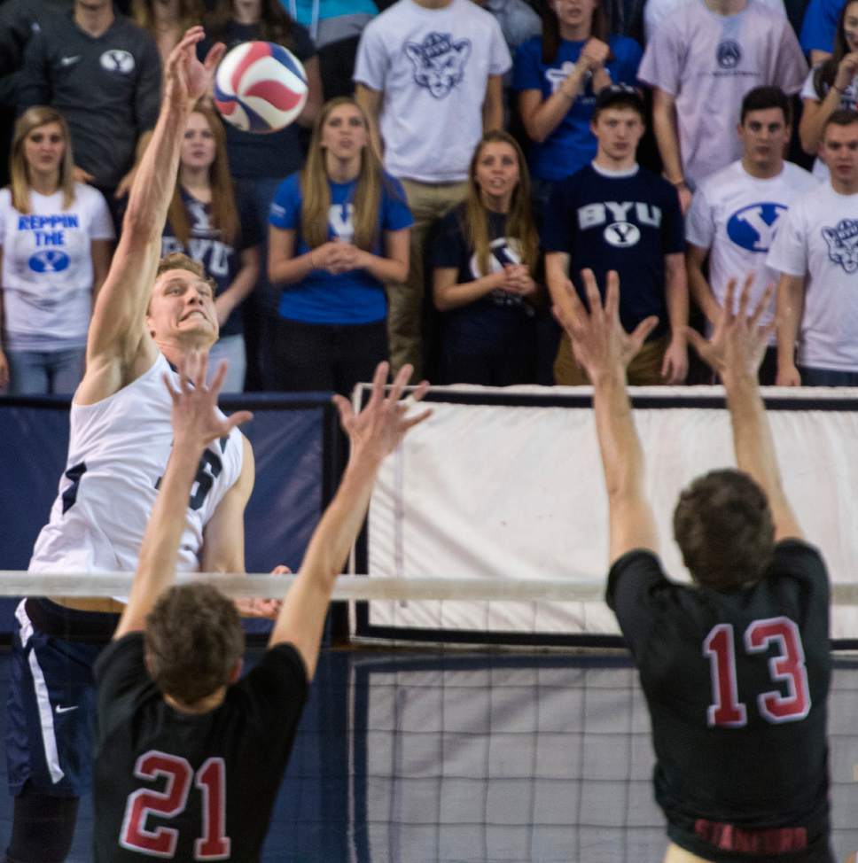 Rick Egan  |  The Salt Lake Tribune

Tim Dobbert (16) BYU, hits the ball as Colin McCall (21) and Kevin Rakestraw (13) defend for Stanford, in Volleyball action, BYU vs. Stanford, at the Smith Field House in Provo,  Saturday, April 15, 2017.