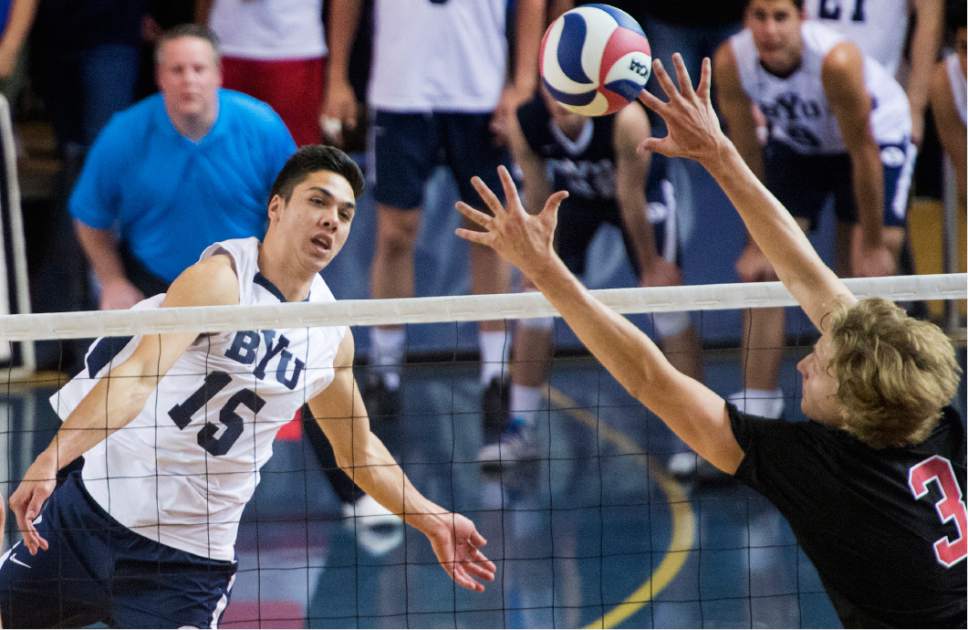 Rick Egan  |  The Salt Lake Tribune

Brenden Sander (5) BYU, hits the ball past Paul Bischoff (3) Stanford, in Volleyball action, BYU vs. Stanford, at the Smith Field House in Provo,  Saturday, April 15, 2017.