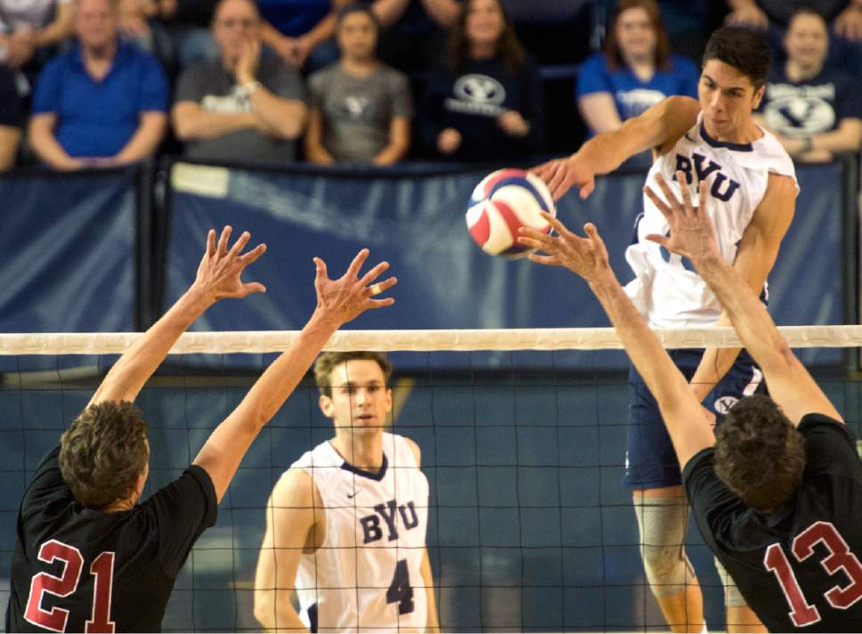 Rick Egan  |  The Salt Lake Tribune

Brenden Sander (15) BYU, hits the ball as Colin McCall (21) and Kevin Rakestraw defend for Stanford, in Volleyball action, BYU vs. Stanford, at the Smith Field House in Provo,  Saturday, April 15, 2017.